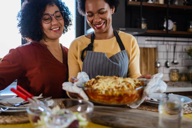 istock Mature lesbian couple preparing dinner at home 1393319744
