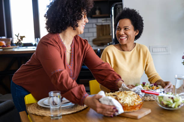 istock Lesbian couple having a romantic dinner at home 1393320438