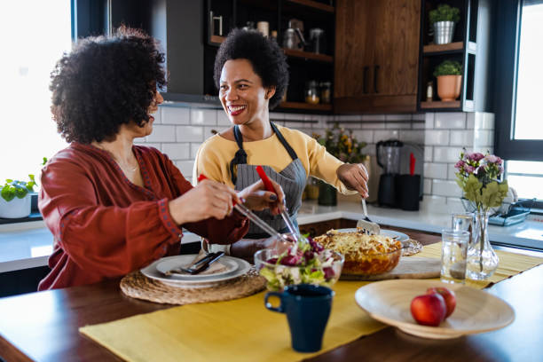 istock Happy lesbian mature couple enjoying in dinner 1393320567