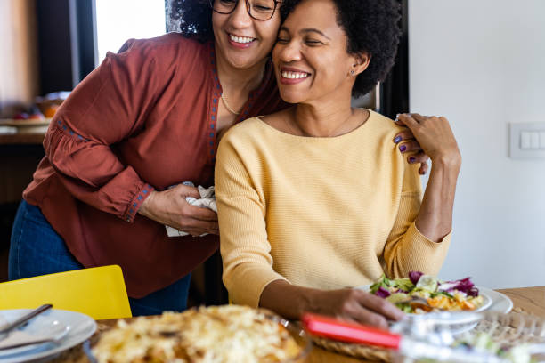 istock Lesbian couple in love. Lunch time 1393320772