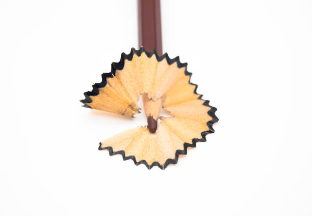 istock pencil shavings on white paper background, selective focus 1393337636