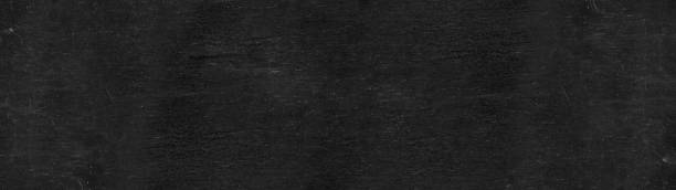 istock Black anthracite stone concrete texture background panorama banner long 1393339285