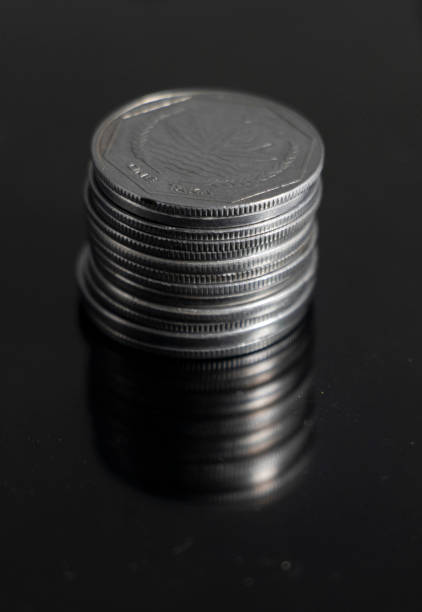 istock A pile of Coins stacks on a black background 1393340610