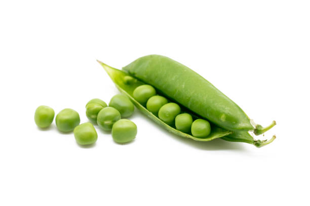 istock green peas vegetable bean isolated on white background.. 1393342759