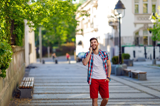 Young urban man using smart phone.