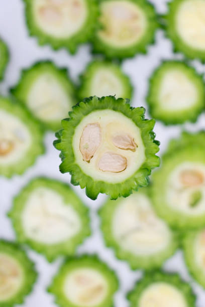 istock some slices of bitter melon isolated on white background. 1393343144