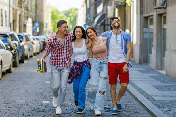 istock Group of school friends walking outdoors lifestyle 1393343217