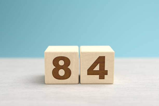 istock Wooden toy blocks forming the number 84. 1393344346