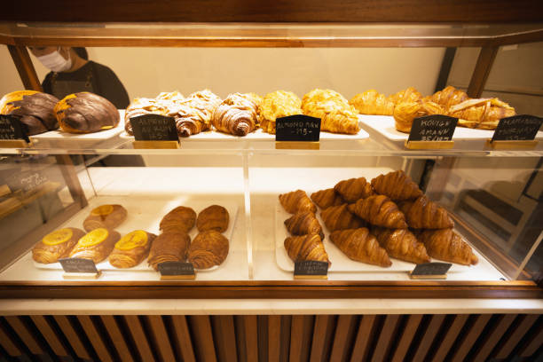 istock freshly baked croissants in bakery shop. 1393344531