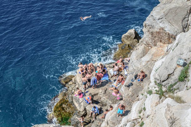 People on the rocky beach