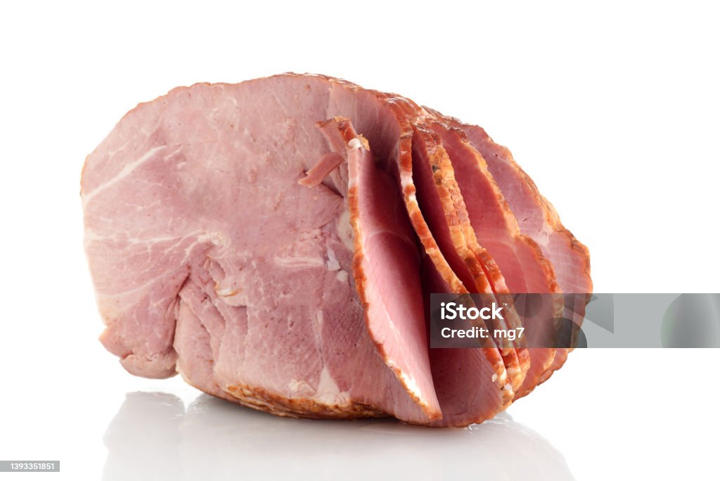 Applewood Smoked Spiral Sliced Bone In Half Ham Applewood Smoked Spiral Sliced Bone In Half Ham on a white background Ham Stock Photo