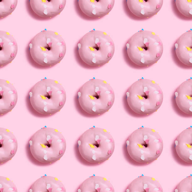 istock Pattern seamless of pink donut with pink background 1393352187