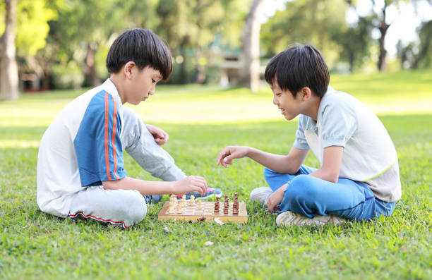 istock Children started the classic a chess match outdoors 1393352256