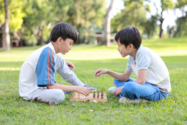 istock Children started the classic a chess match outdoors 1393352263