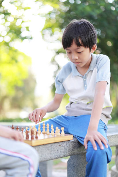 istock Children started the classic a chess match outdoors 1393352398