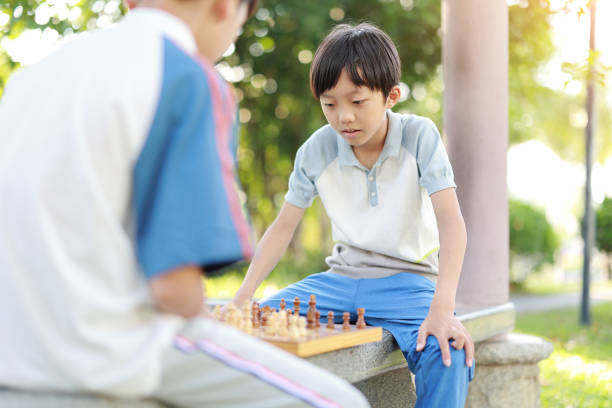 istock Children started the classic a chess match outdoors 1393352400
