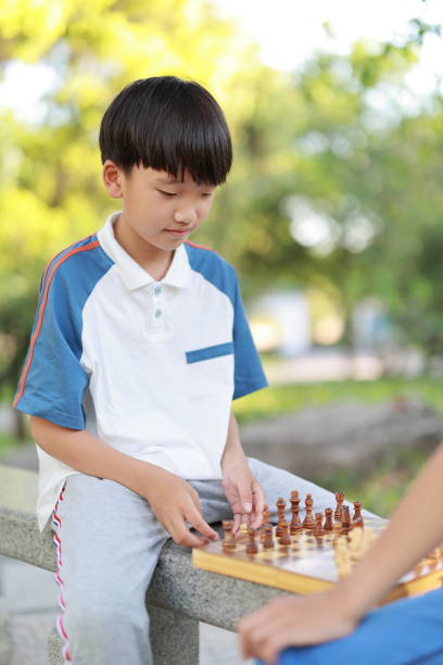 istock Children started the classic a chess match outdoors 1393352427