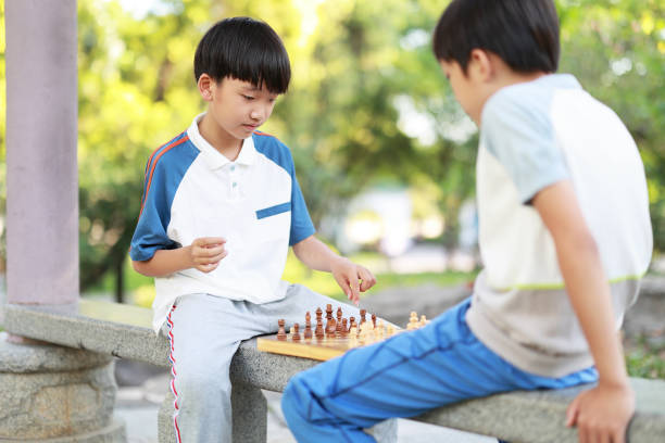 istock Children started the classic a chess match outdoors 1393352452
