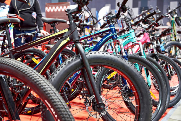Modern mountain bikes in sports shop Row modern mountain bicycles in sports shop bicycle shop stock pictures, royalty-free photos & images