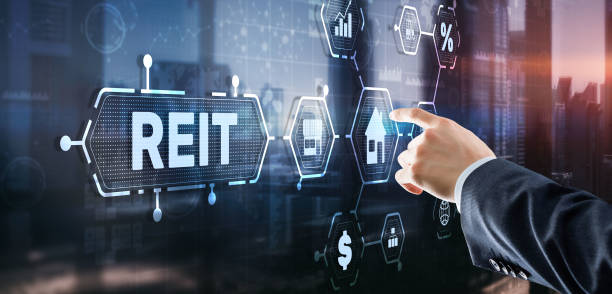REIT. Real estate investment trust. Financial Market. Hand pressing button on screen stock photo