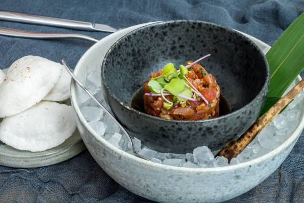 istock Tuna tar tar with avocado on ice side view 1393359186