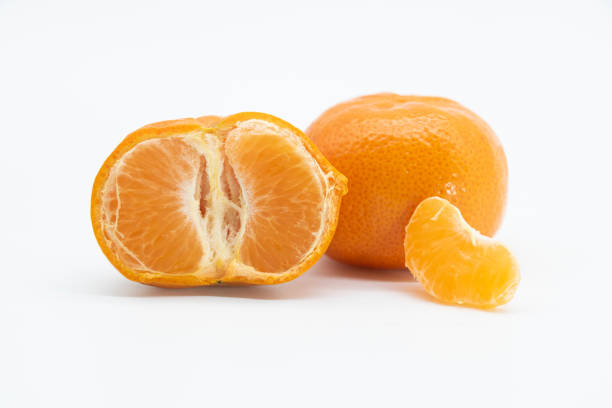 istock mandarin or komola fruit over on white background.selective focus 1393360618