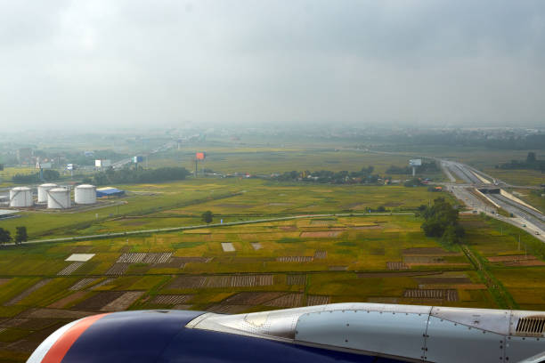 istock green fields and cloudy sky from an airplane window. view from the airplane window 1393362201