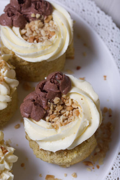 istock Sponge cake with butter cream. Sprinkled with peanuts. Close-up shot. 1393362292