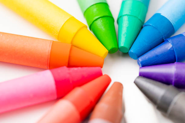 istock Circle made of multicolored crayons on white background 1393363285