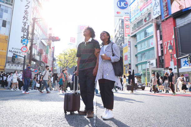 istock Young black couple taking a walk during their travel 1393363295