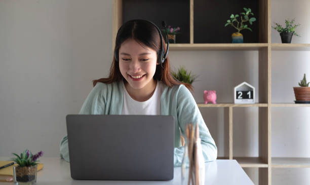 istock E-learning ,online ,education and internet social distancing protect from COVID-19 viruses concept. Asian woman student video conference e-learning with teacher on laptop computer at home. 1393363737