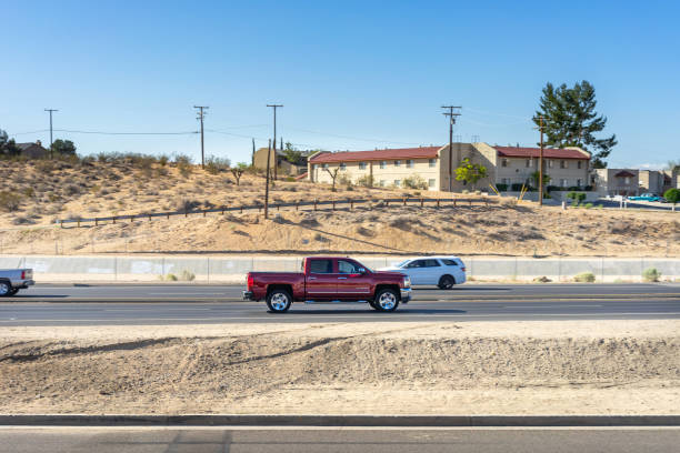 Chevy Silverado pickup truck Apple Valley, CA, USA – April 20, 2022: A Chevy Silverado pickup truck traveling on Highway 18 in Apple Valley, California. chevrolet silverado stock pictures, royalty-free photos & images