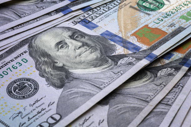 istock Pile of one hundred american dollars bills 1393366765