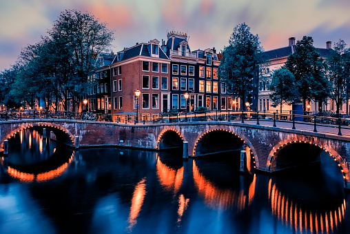 Gravestenenbrug bridge on Spaarne river and old canal houses in Haarlem, Netherlands.
