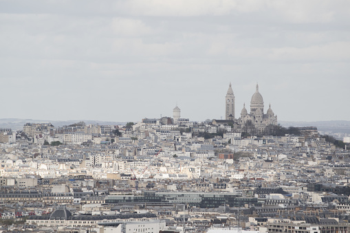 Paris: aerial view from the top of the Eiffel Tower with Montmartre hill, the highest point in the city, and Basilica of the Sacred Heart, Roman Catholic church completed in 1914