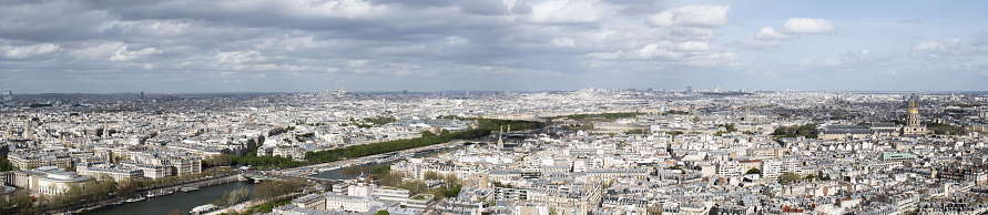 Paris: aerial view from the top of the Eiffel Tower with river Seine, Montmartre hill and Basilica of the Sacred Heart until the Saint Louis cathedral in the Les Invalides complex