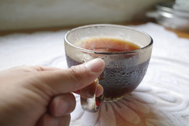Holding a cup of delicious American coffee