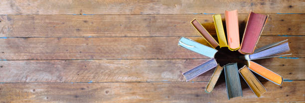 istock Books arrangement, flat lay on wooden table. Back to school,education,reading, learning, home office concept. Free copy space, negative space technique. 1393375367