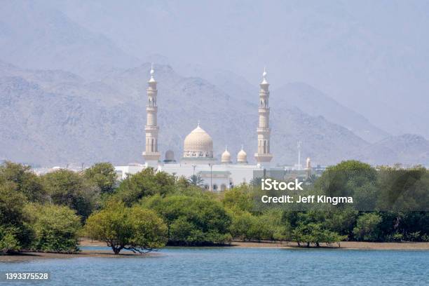 View Across Mangroves To Kalba Mosque In Sharjah United Arab Emirates Stock Photo - Download Image Now