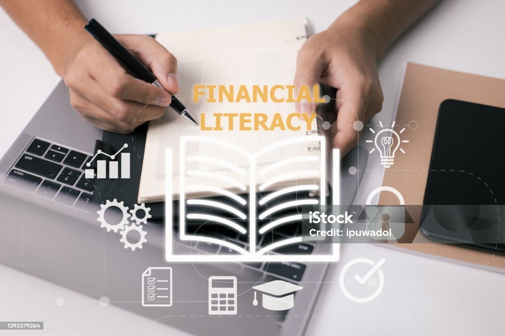 Person idea of financial literacy and education is based on learning from books. Reading classes can help you gain economic information and improve personal abilities. Money management and planning. Accountancy Stock Photo