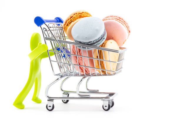 istock man pushing shopping cart with macaron 1393379466