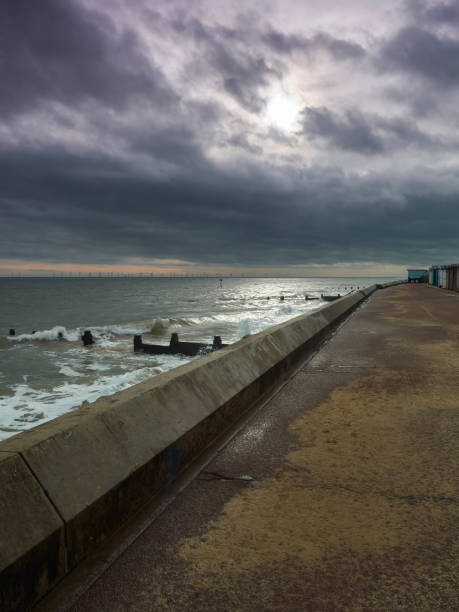 istock Sea Wall, Surf and Sunburst 1393380361