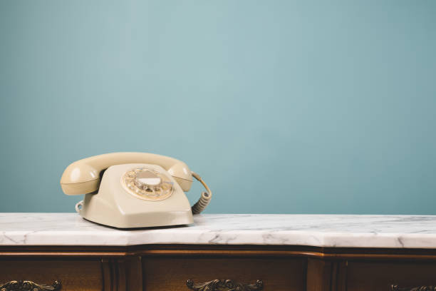 istock Close-up view of an old telephone on a table. 1393384716
