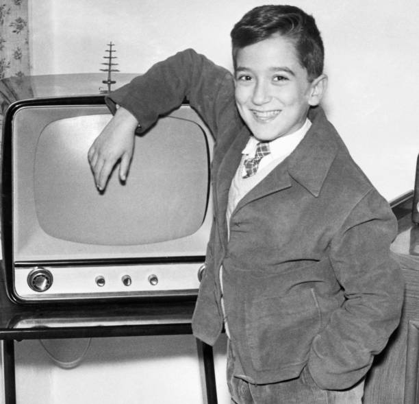Boy and First TV in 1950. stock photo