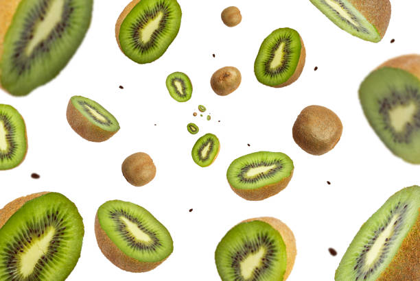 istock Collection of fresh real Kiwi fruit falling isolated on white background. Selective focus 1393391361