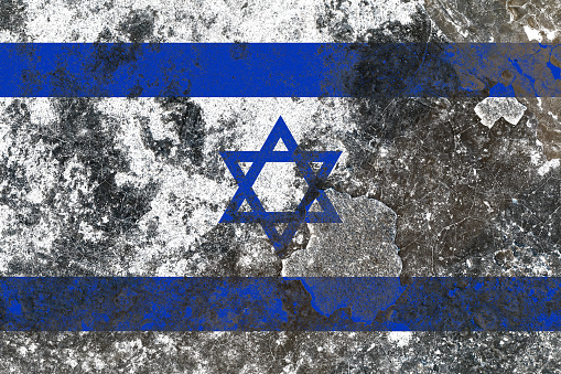 Israel flag on a damaged old concrete wall surface
