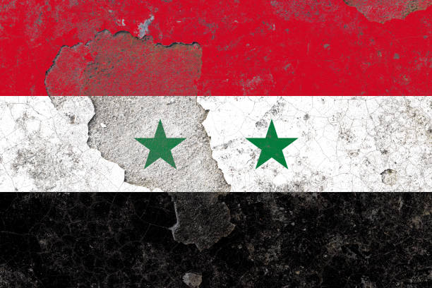 istock Syria flag on a damaged old concrete wall surface 1393392830