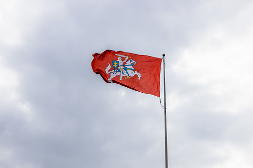 Galicia flag fluttering in the wind at dusk. Clear sky in the background. Galicia, Spain.