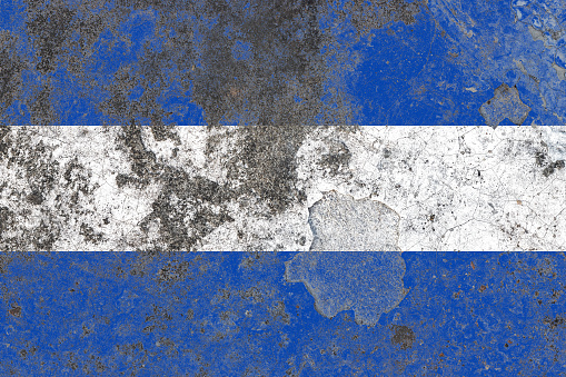El salvador flag on a damaged old concrete wall surface