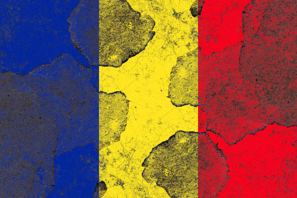 istock Romania flag on a damaged old concrete wall surface 1393398860